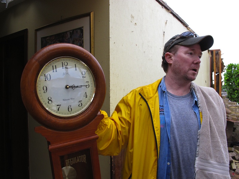 Kevin Metz shows holds up a stopped clock he found in the rubble of his father's home in Moore, Okla., on Tuesday, May 21, 2013. Monday's EF5 tornado destroyed Wayne Osmus' home and much of the Oklahoma City suburb. (AP Photo/Allen Breed)