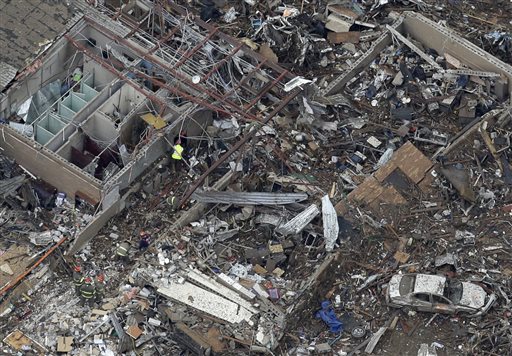 An aerial view shows Tower Plazas Elementary school in Moore, Okla., on Tuesday as rescue workers make their way through the structure. At least 24 people, including nine children, were killed in the massive tornado that flattened homes and a school in Moore.