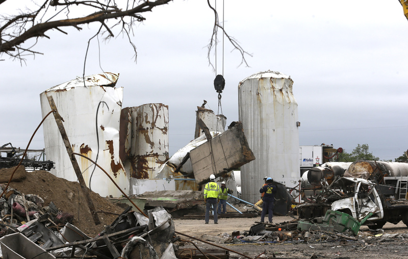 Investigators look through the debris of the destroyed fertilizer plant in West, Texas, on May 2.