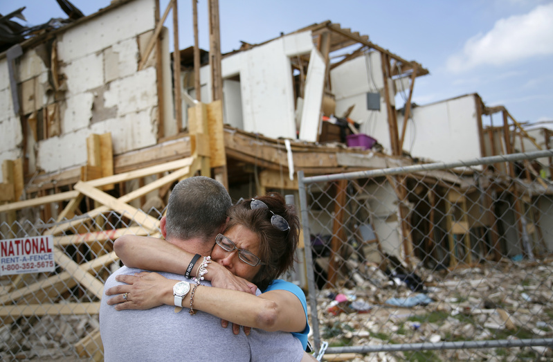 Shona Jupe, a resident of an apartment destroyed by the fertilizer plant explosion, hugs a friend while visiting the site in West, Texas, on May 10. Jupe was at the front door when the West Fertilizer Co. explosion happened.