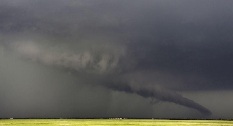 The funnel of a tornadic thunderstorm almost touches the ground near South Haven, in Kansas May 19, 2013. A massive storm front swept north through the central United States on Sunday, hammering the region with fist-sized hail, blinding rain and tornadoes, including a half-mile wide twister that struck near Oklahoma City. News reports said at least two people had died. (REUTERS/Gene Blevins) :rel:d:bm:GF2E95K0J0Q01