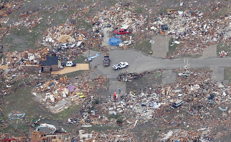 An aerial view of destroyed homes in Moore, Oklahoma May 21, 2013, in the aftermath of a tornado which ravaged the suburb of Oklahoma City. Rescuers went building to building in search of victims and thousands of survivors were homeless on Tuesday, a day after a massive tornado tore through Moore, wiping out whole blocks of homes and killing at least 24 people. Seven children died at the school which took a direct hit in the deadliest tornado to hit the United States in two years. (REUTERS/Rick Wilking)