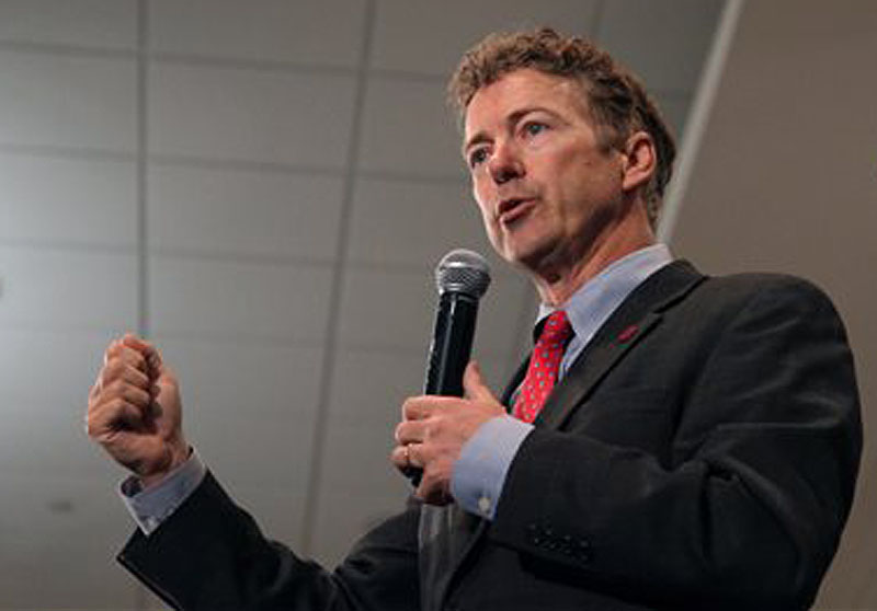 Sen. Rand Paul, R-Ky., speaks at the Iowa GOP Lincoln Dinner event Friday in Cedar Rapids, Iowa. Paul wrote an opinion piece in The Washington Times restating his view that President Obama should have fired then-Secretary of State Hillary Rodham Clinton after the terrorist attack on the U.S. diplomatic compound in Benghazi.