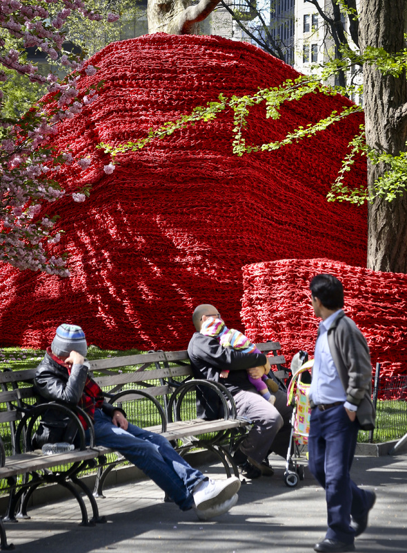 Part of more than 1.4 million feet of painted, hand-knotted rope by artist Orly Gender titled "Red, Yellow and Blue," is installed in Madison Square Park on Wednesday in New York. The installation will be on view until Sept. 8.
