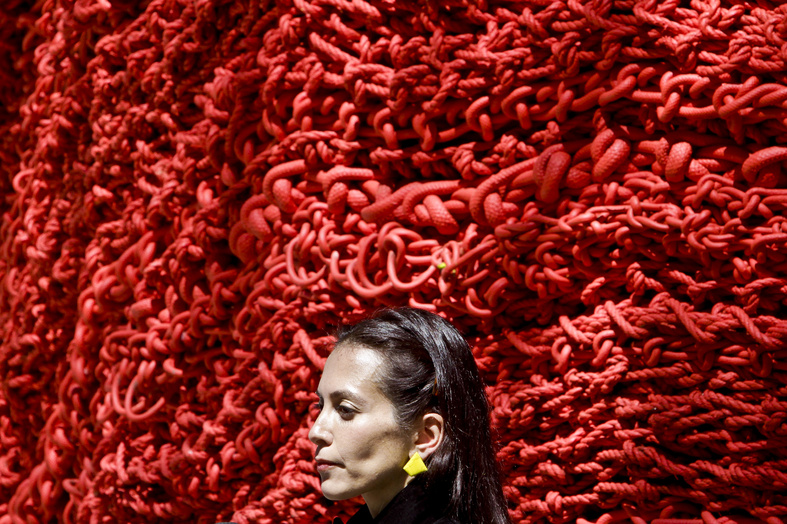 Artist Orly Gender stands next to her art installation made of repurposed lobster rope in Madison Square Park on Wednesday in New York.