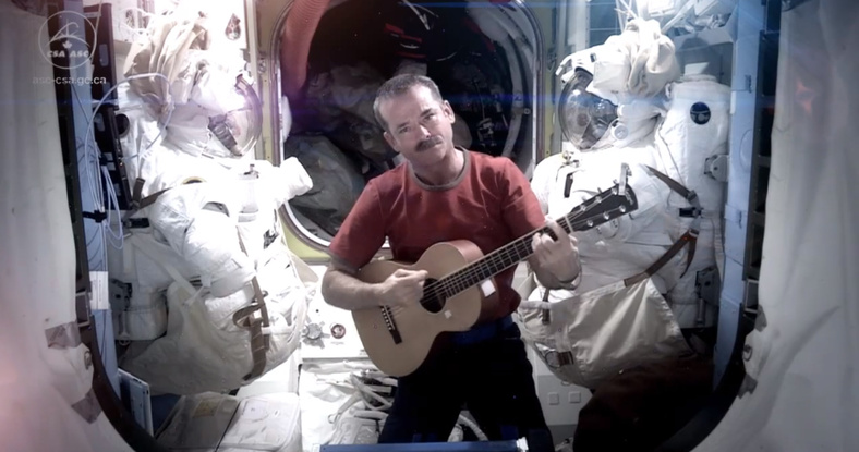 Astronaut Chris Hadfield recorded the first music video from space Sunday. The song was his cover version of David Bowie's "Space Oddity."