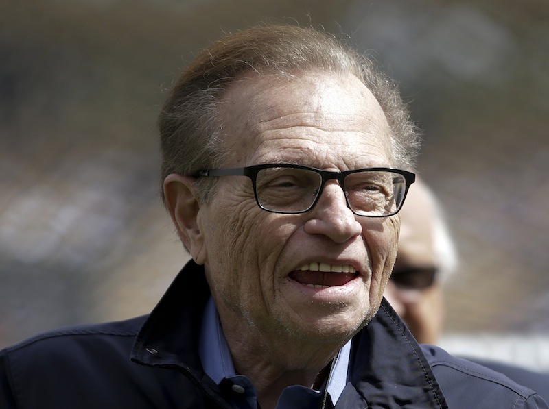 This April 1, 2013 photo shows talk show host Larry King attending a season-opening baseball game between the Los Angeles Dodgers and the San Francisco Giants in Los Angeles. King will host a political talk show beginning next month. The new program, "Politics with Larry King," will air on the RT America network, a global, English-language channel based in Russia, the network announced Wednesday, May 29, 2013. No premiere date was specified. (AP Photo/Jae C. Hong)