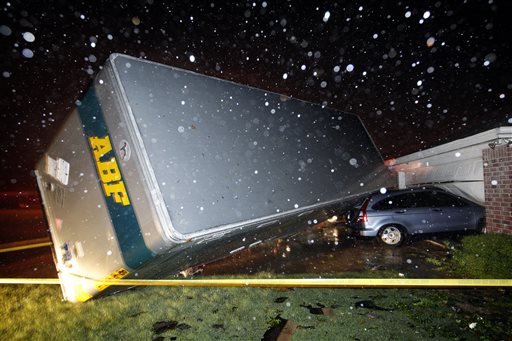 A trucking company trailer landed on a car that was parked in front of a home in Cleburne, Texas, after a powerful storm went through Wednesday night.