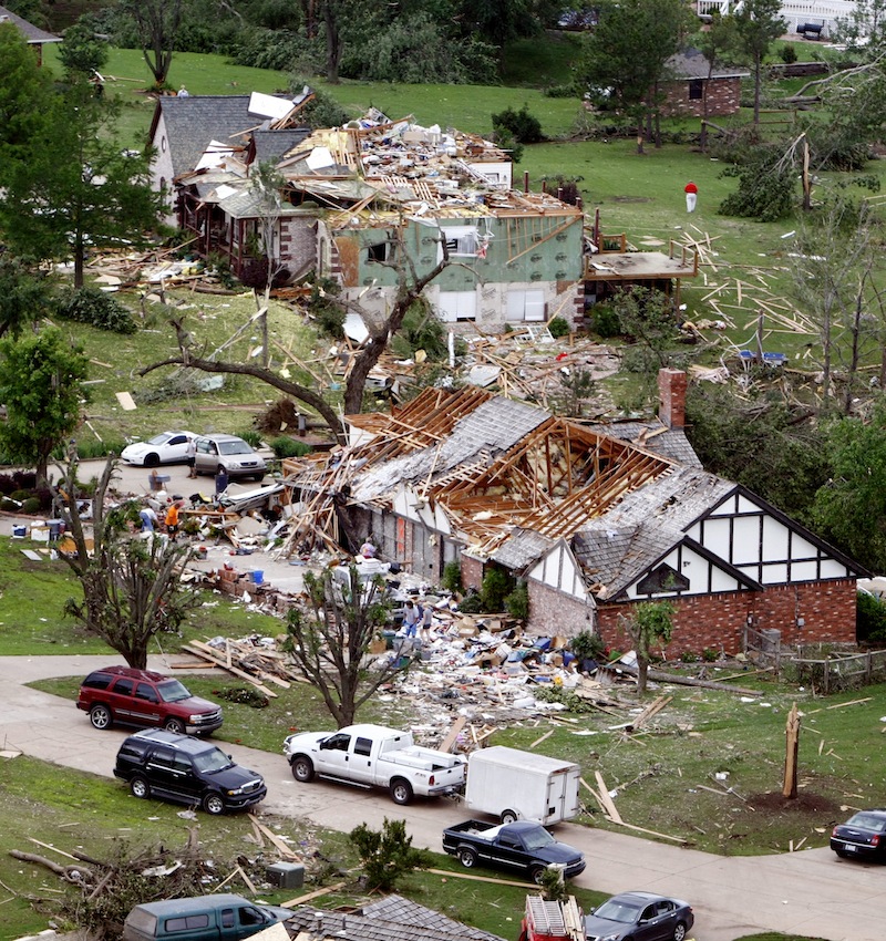 This aerial photo shows damage in the Rolling Meadow Estates neighborhood on Friday, May 31, 2013 in Broken Arrow, Okla. after a tornado passed the area overnight. The storms rolled across the region overnight, and more bad weather was poised to strike Friday, with tornadoes and baseball-sized hail forecast from Oklahoma, Kansas and Missouri. Flooding also is a concern in parts of Missouri, Iowa and Illinois through Sunday. (AP Photo/Tulsa World, Tom Gilbert)
