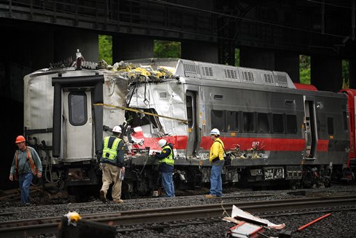 Metro-North employees work at the site of Friday's train derailment in Bridgeport. Conn., on Sunday. Brian A. Pounds;pounds;connecticut post;connpost.com