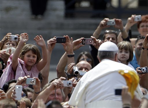 Pope Francis greets the faithful at the end of a canonization Mass in St. Peter's Square at the Vatican Sunday. The pontiff canonized Antonio Primaldo and his companions, also known as the Martyrs of Otranto; Laura di Santa Caterina da Siena Montoya of Colombia; and Maria Guadalupe Garcia Zavala of Mexico.