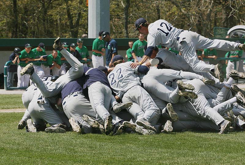 The University of Southern Maine celebrates their 9-0 victory over Endicott College Sunday in the championship game of the NCAA Division III New England Regional in Harwich, Mass.