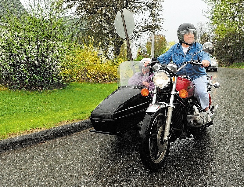 Donna McGibney, 61, rides her motorcycle with her mother, Charlotte McGibney, 88, in the sidecar Friday in Readfield. They’re celebrating their fifth Mother’s Day since the purchase.
