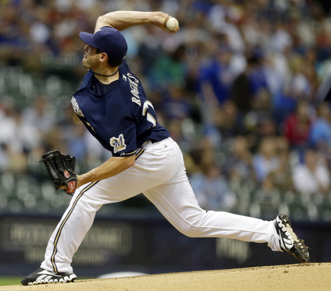 Milwaukee Brewers starting pitcher Mark Rogers throws to the Chicago Cubs in August 2012.