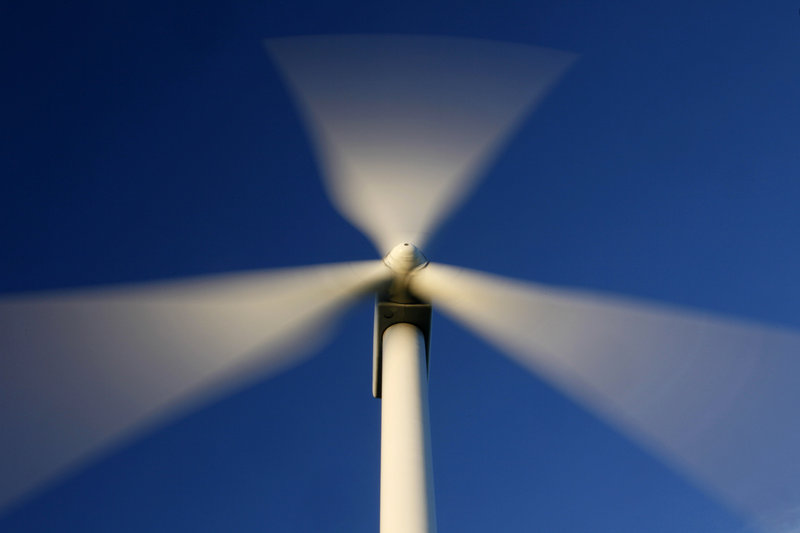 Blades rotate on a wind turbine on Maine's Stetson Mountain in this July 2009 file photo. The wind industry's grip on Augusta may be weakening. (AP Photo/Robert F. Bukaty)