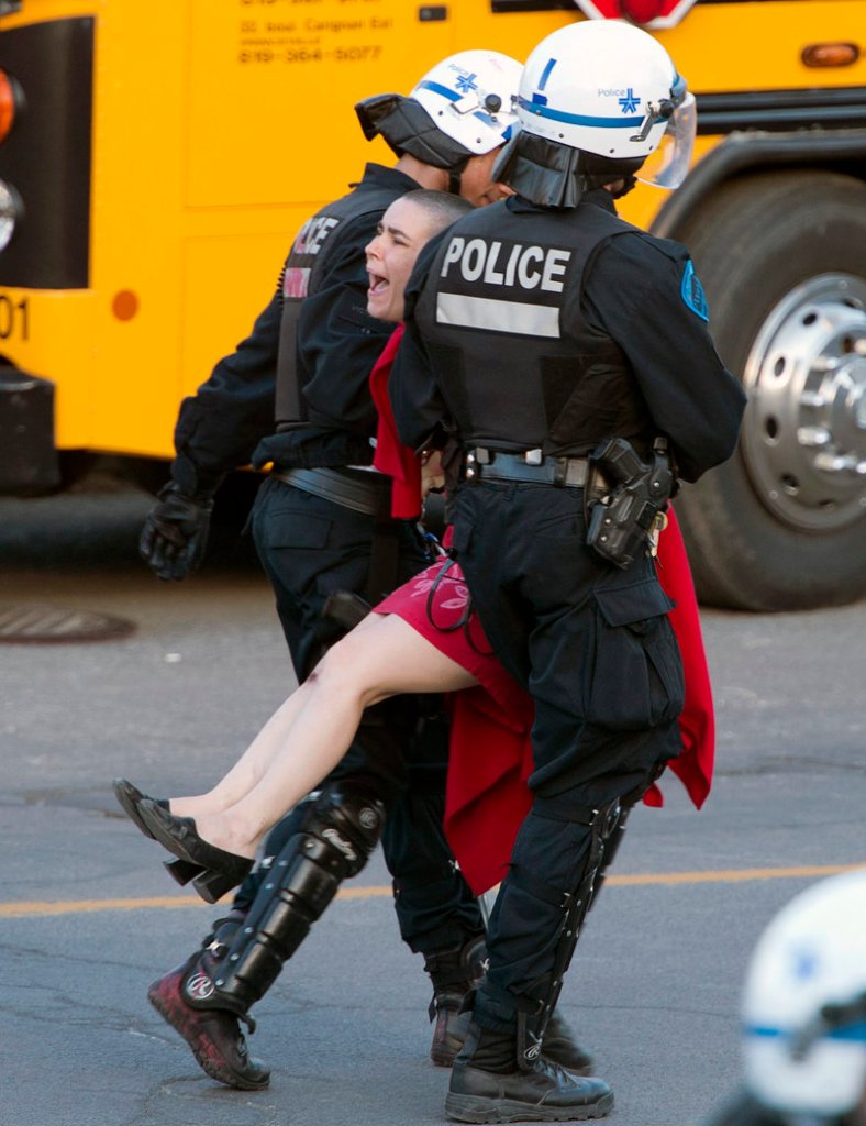 A protester is carried away by police during a May Day demonstration Wednesday in Montreal.