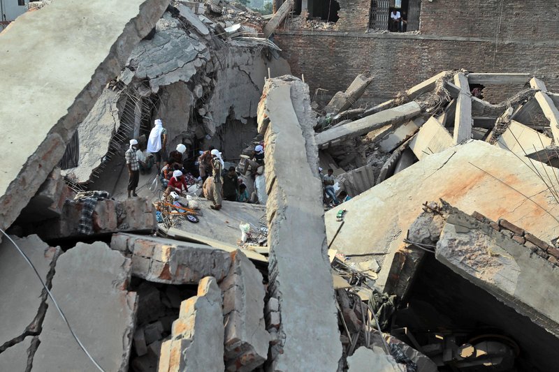 Bangladeshi rescuers work at the site of a building that collapsed in Savar, near Dhaka, Bangladesh. The death toll rose to 547 on Saturday and was expected to climb higher.