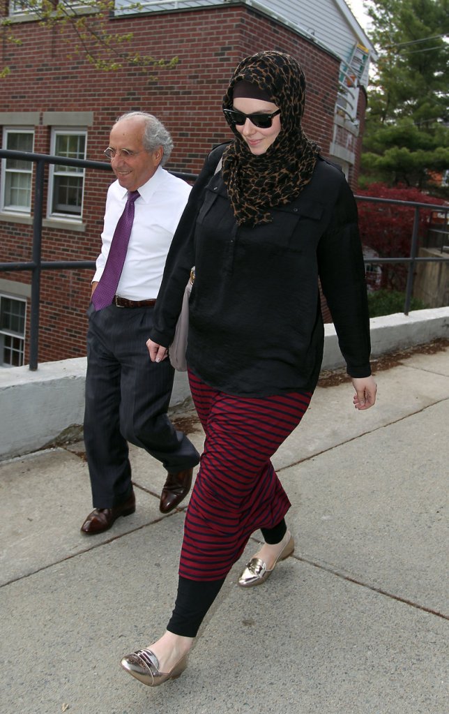 Katherine Russell, widow of Boston Marathon bomber  Tamerlan Tsarnaev, leaves the law office of DeLuca and Weizenbaum with Amato DeLuca, in Providence, R.I., in this April 29, 2013, photo. The Associated Press