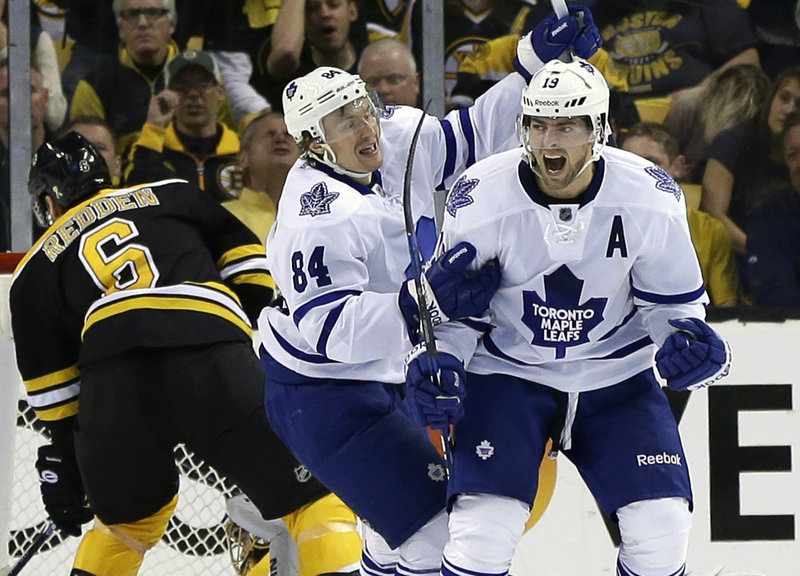 Joffrey Lupul (right) of the Maples Leafs celebrates his goal with Mikhail Grabovski (center) during Toronto’s 4-2 win in Game 2 over Boston in their first-round playoff series.