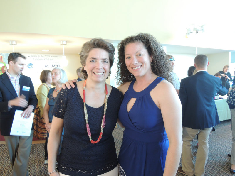 Lori Voornas from radio station Q97.9, left, the volunteer emcee for the silent auction, and Jen Libby of Falmouth
