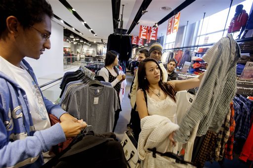 Shoppers browse at an H&M store in Atlanta last December. If we want to see working conditions improve at the factories that make clothes for H&M, L.L. Bean and other retailers, it would be better for these companies to stay in places like Bangladesh and work with monitors who inspect working conditions.