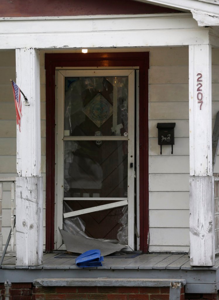 This is the screened front door of a house in Cleveland where Amanda Berry seized a chance to escape after being kidnapped and held captive for 10 years.