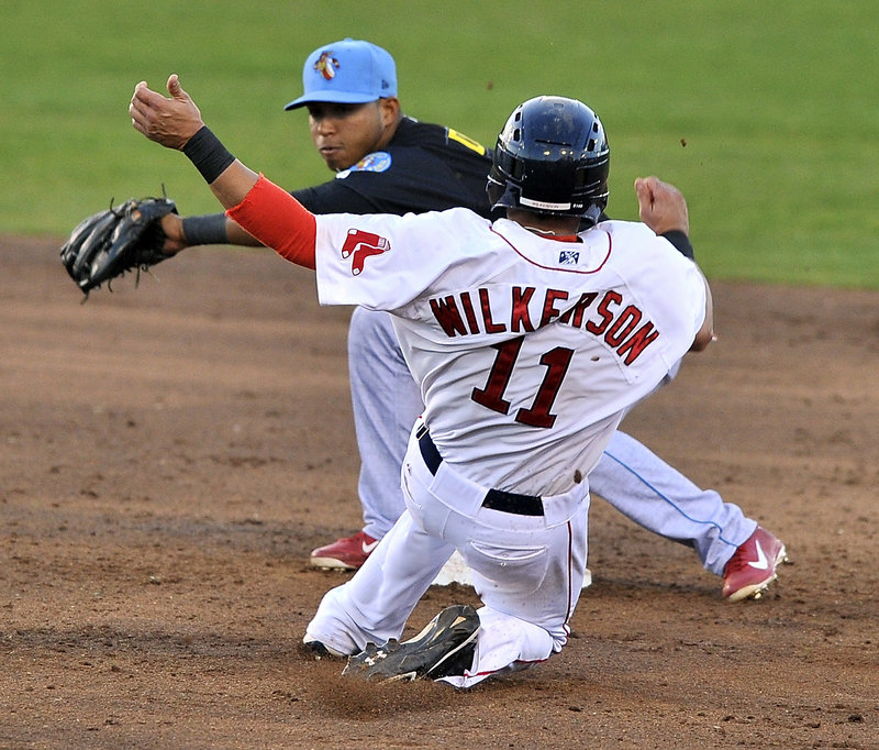 Portland’s Shannon Wilkerson slides into second on a steal attempt, but Reading’s Albert Cartwright is waiting to apply the tag for an out Monday night at Hadlock Field. The Sea Dogs lost, 5-1.