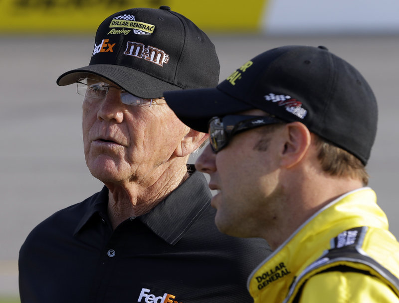 Team owner Joe Gibbs, left, talks with driver Matt Kenseth during qualifying for the NASCAR Sprint Cup series race in Richmond, Va., late last month.