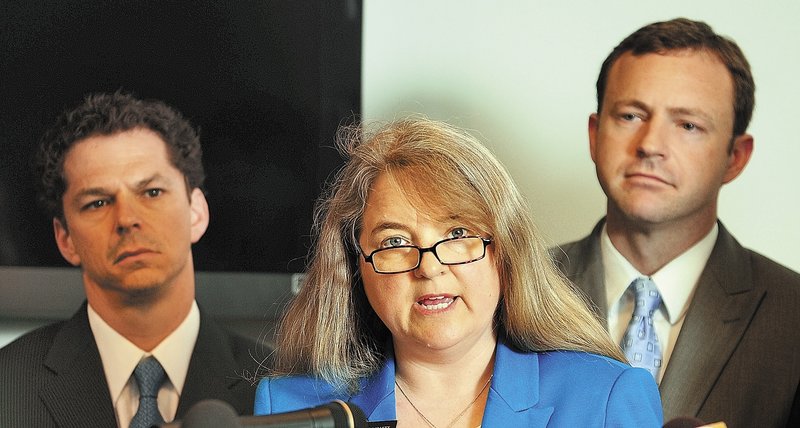 Sen. Rebecca Millett, with Sen. Justin Alfond, left, and Rep. Mark Eves, announce a Democratic plan to grade Maine schools during a State House news conference Wednesday in Augusta.