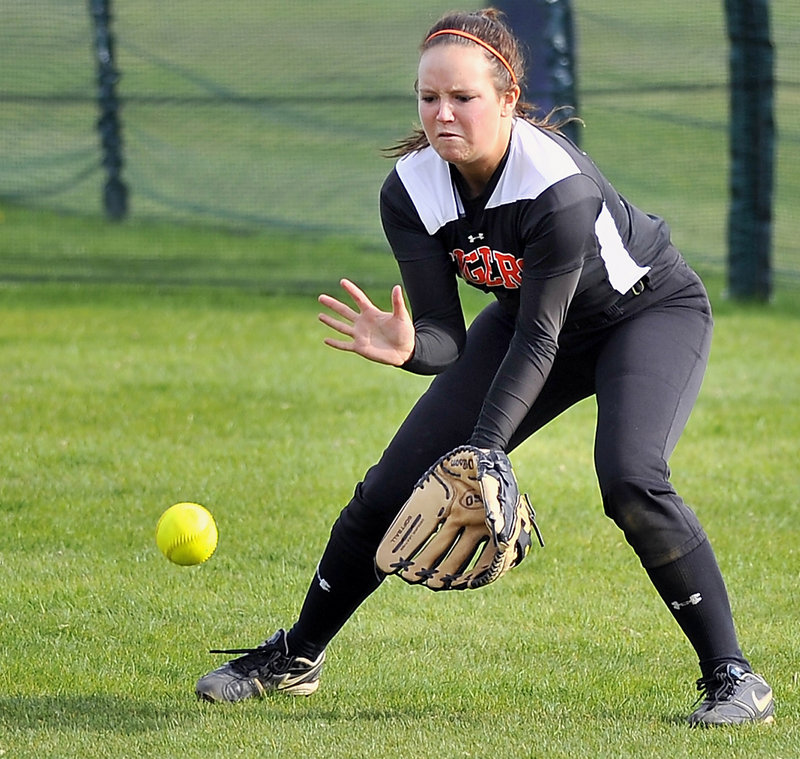 Sara Scott fields a ball hit to center during Biddeford’s 5-3 win over Cheverus on May 8 – one of two close victories that helped the Tigers keep alive what is now a nine-game winning streak.
