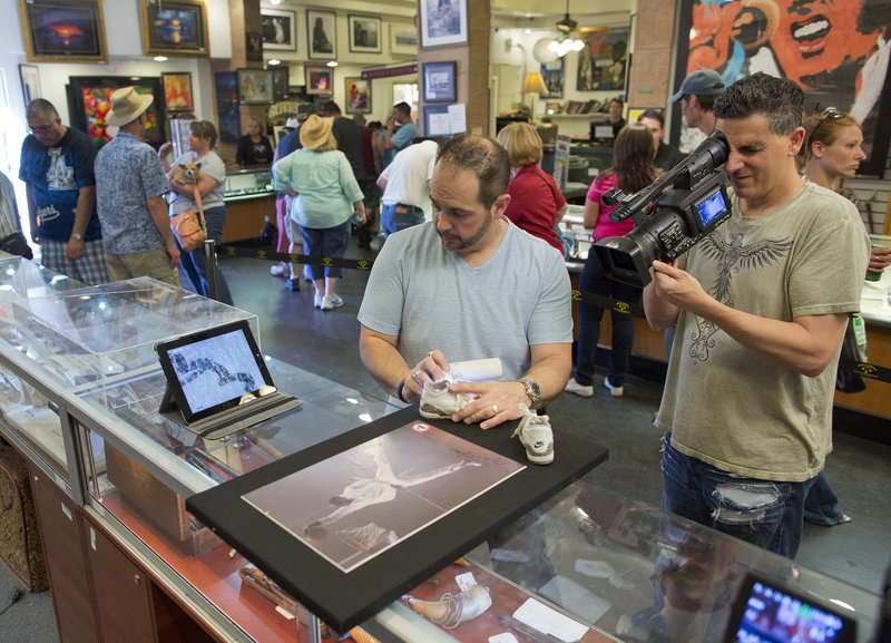 Cameraman Joe Murgia shoots a close-up of Michael Jordan memorabilia that was brought in to the Gold & Silver Pawn shop in Las Vegas for the “Pawn Stars” show on the History channel.