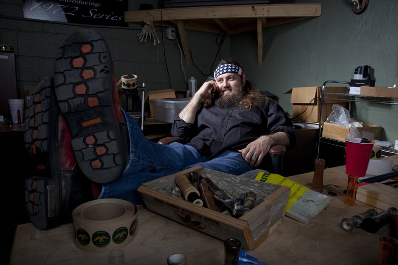Willie Robertson, star of A&E’s “Duck Dynasty,” relaxes at the Duck Commander warehouse in West Monroe, La. Cameras follow Robertson and his family as they make duck calls, hunt or go camping.