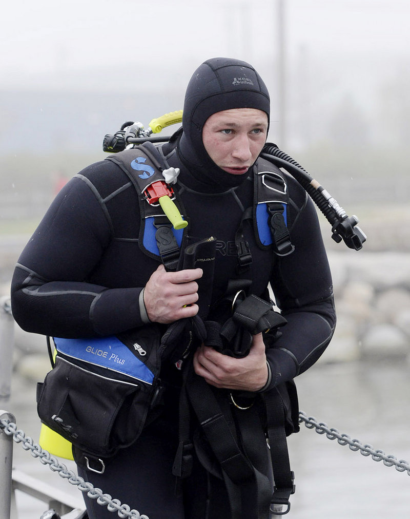 A.J. Nelson of the South Portland Dive Team prepares to go out for training in Portland Harbor on Thursday.