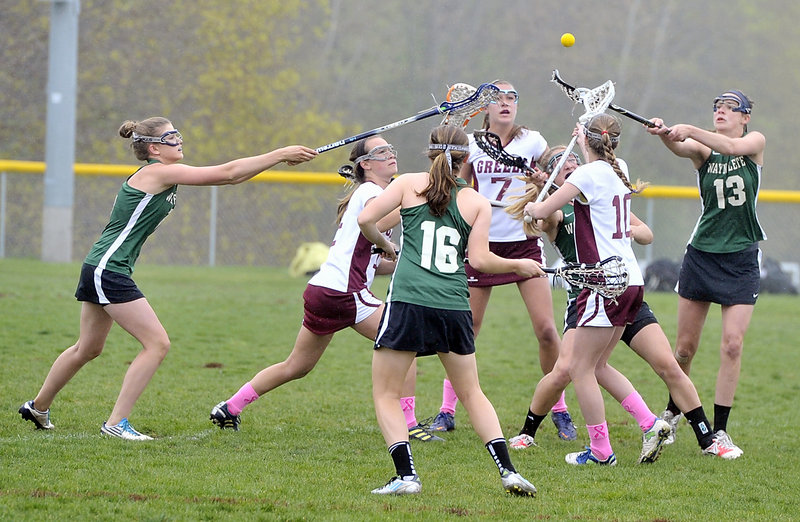 The ball was in the air and, as it turned out, so was fog. Then drizzle. Then a full-fledged rainstorm. So although Waynflete, in green, and Greely got to start their schoolgirl lacrosse game Thursday, the end came much too soon because of the weather. On to another day. A much sunnier day.
