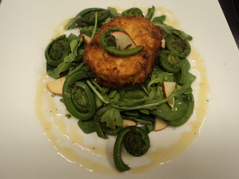 A goat cheese croquette with marinated fiddlehead salad from chef Mitchell Kaldrovich at Sea Glass at Inn By the Sea in Cape Elizabeth.