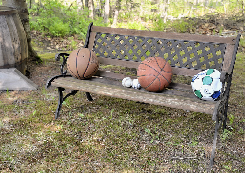 Sports balls are laid upon a bench in the garden made by Ramona Torres of Denmark, dedicated to her son Angel “Tony” Torres, who disappeared 14 years ago.