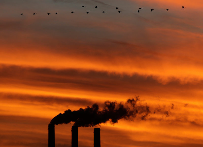 Geese share the atmosphere with emissions from the smokestacks at the Jeffrey Energy Center coal power plant as the sun sets near Emmett, Kan. With carbon dioxide now measuring at 400 parts per million, the greenhouse gas has reached a level that probably has not been reached for at least 2 million years.