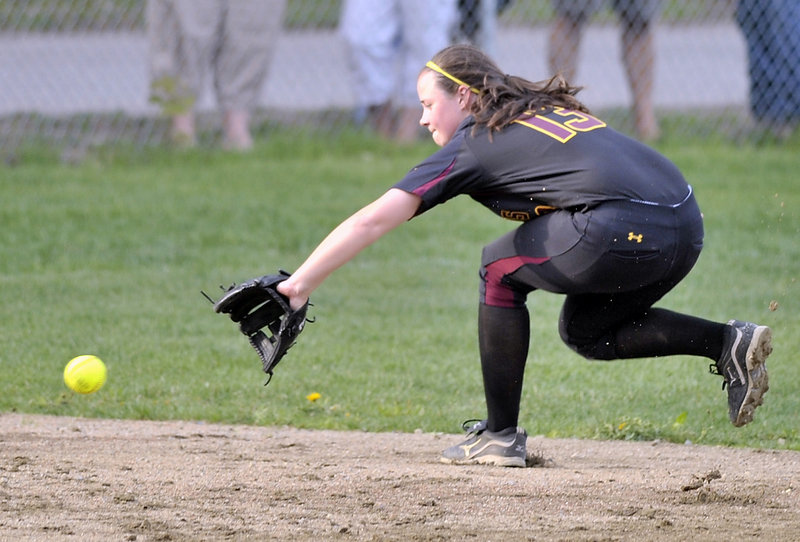 Ashley Tinsman of Cape Elizabeth goes into the shortstop hole Friday to snag a hard-hit grounder and prevent a run. The Capers remained undefeated and handed Fryeburg Academy its first loss with a 9-6 victory in a Western Maine Conference game.