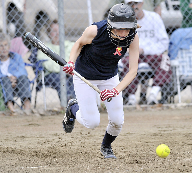 Maddie Foster lays down a bunt and begins her charge to first base against Cape Elizabeth. Foster was safe on the play.