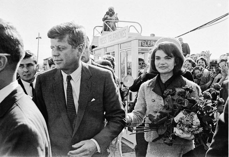 President John F. Kennedy and his wife, Jacqueline Kennedy, arrive at the airport in Dallas on Nov. 22, 1963, shortly before JFK was assassinated. PBS says its fall schedule will include a variety of specials marking President Kennedy’s death 50 years ago.