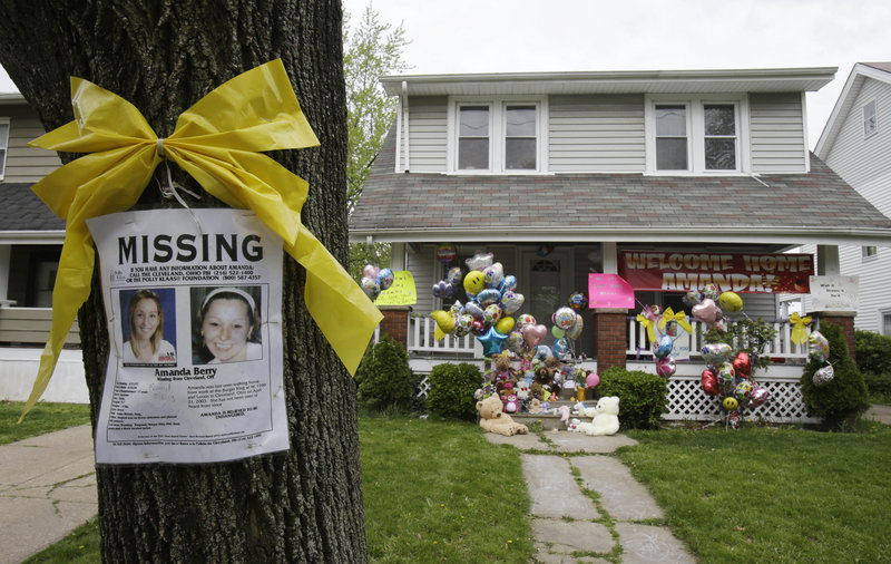 A poster and bow are still tied to a tree outside the Cleveland home of Amanda Berry, where a welcome sign and balloons decorate the porch. For Berry, Gina DeJesus and Michelle Knight, recovery from captivity will be a challenging process.