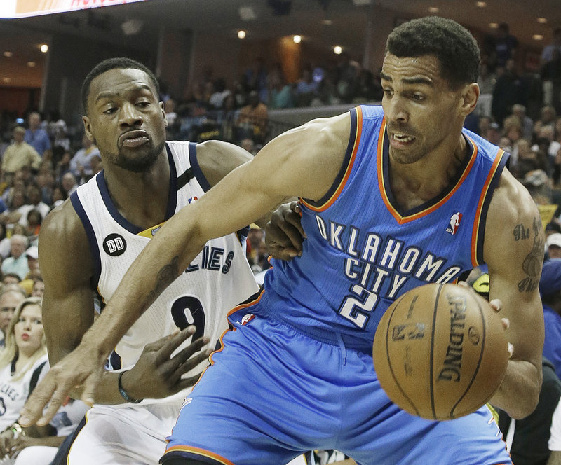 Thabo Sefolosha of the Oklahoma City Thunder moves the ball against Tony Allen of the Memphis Grizzlies during the first half of the Grizzlies’ 87-81 victory Saturday.