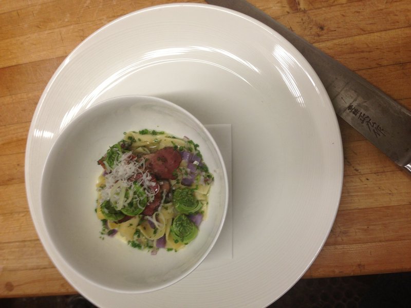 From chef Mitch Gerow at the East Ender in Portland, fiddleheads with egg noodles, tasso ham and purple potatoes.