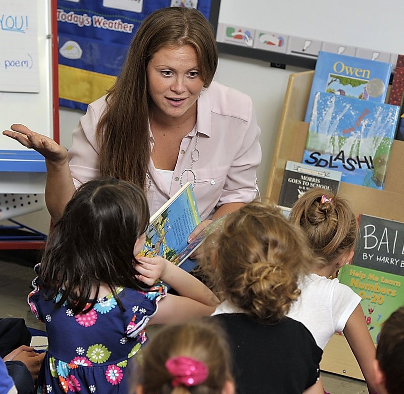 First-grade teacher Ashley Martin discusses the book “The Circus Ship” with her students at Coffin Elementary School in Brunswick last fall. A reader says that Gov. LePage’s criticism of public school teachers shows a lack of respect “for a profession so necessary to the fabric of the republic.”