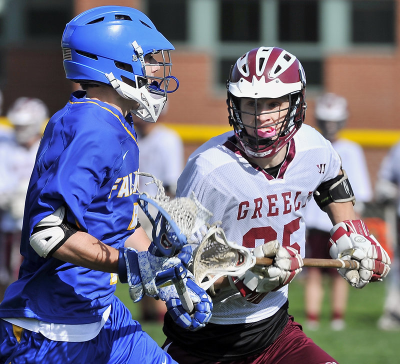 Falmouth’s Brad Gilbert, left, is challenged by Greely’s Fred Bower during the visiting Yachtsmen’s 12-3 win Monday. Falmouth improved to 6-2 while Greely dropped to 5-3.