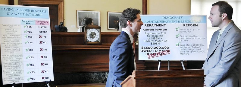 Senate President Justin Alfond and House Speaker Mark Eves confer March 11 after unveiling a plan to combine a decision on Medicaid expansion with a proposal to pay hospital debt. Gov. LePage has said that the plan is an effort to link disparate issues.
