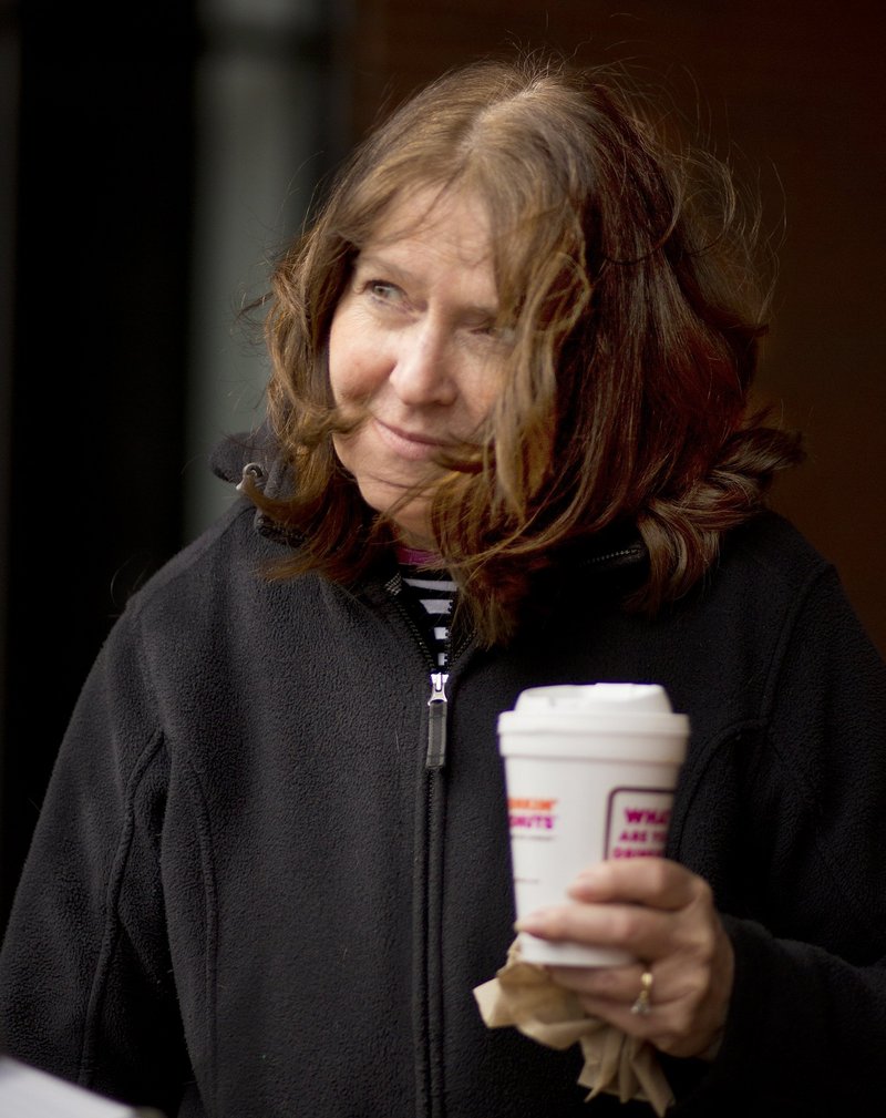 Maryellen O’Toole of Scarborough carries a cup of coffee from a Portland Dunkin’ Donuts. A reader wonders if the city of Portland’s proposed ban on Styrofoam packaging would apply to things like the cups, which are made not of Styrofoam but of a different material – expanded polystyrene,