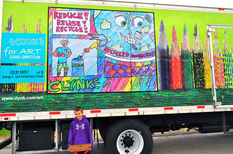 Fourth-grader Colby Frost has won the George E. Jack School’s recent “Clynk For Art” Competition. Colby poses in front of a Clynk recycling truck, decorated with his winning artwork displayed on both sides.