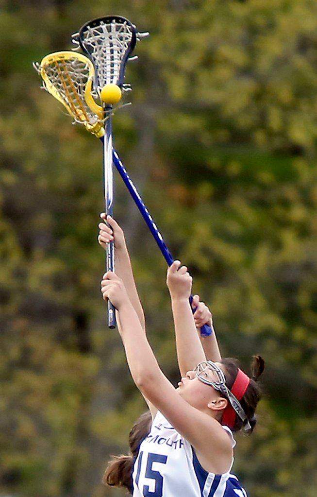 Grace O’Donnell of Yarmouth reaches up for the ball during York’s 12-9 win Thursday.