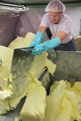 Dan Patry produces butter at Kate’s Homemade Butter in Old Orchard Beach. Neighbors have complained that Kate’s should not be operating in a residential neighborhood.